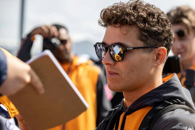 3rd July 2022, Silverstone Circuit, Silverstone, Northamptonshire, England: British F1 Grand Prix, Race day: McLaren F1 Team driver Lando Norris signs fans autographs  ActionPlus12404508 TimxWilliams