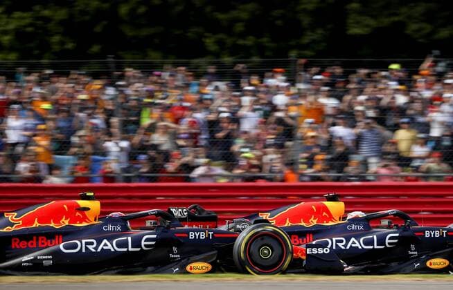 NORTHAMPTON Sergio Perez 11 driving the Oracle Red Bull Racing RB18 Honda and Max Verstappen 1 driving the Oracle Red Bull Racing RB18 Honda during the F1 Grand Prix of Great Britain at Silverstone on July 3, 2022 in Northampton, England REMKO DE WAAL F1 Grand Prix of Great Britain 2022 xVIxANPxSportx xxANPxIVx 451279718 originalFilename: 451279718.jpg