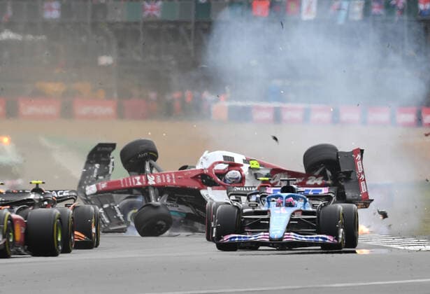 3rd July 2022, Silverstone Circuit, Silverstone, Northamptonshire, England: British F1 Grand Prix, Race day: Zhou Guanyu of China driving the (24) Alfa Romeo F1 C42 Ferrari is hit at the start and his car begins to roll over down the track  ActionPlus12404607 SimonxWest