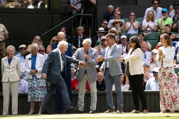 Mandatory Credit: Photo by Ella Ling Shutterstock (13012853dm) Rod Laver is greeted by former champions as he walks onto Centre Court for the centenary celebrations Wimbledon Tennis Championships, Day 7, The All England Lawn Tennis and Croquet Club, London, UK - 03 Jul 2022 Wimbledon Tennis Championships, Day 7, The All England Lawn Tennis and Croquet Club, London, UK - 03 Jul 2022  Copyright: xEllaxLing Shutterstockx 13012853dm