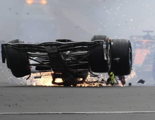 3rd July 2022, Silverstone Circuit, Silverstone, Northamptonshire, England: British F1 Grand Prix, Race day: Zhou Guanyu of China driving the (24) Alfa Romeo F1 C42 Ferrari is hit at the start and his car rolls, sliding upside down towards the barriers  ActionPlus12404615 SimonxWest