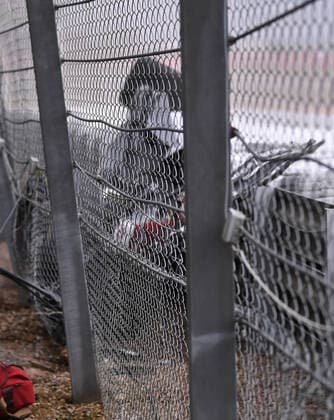 3rd July 2022, Silverstone Circuit, Silverstone, Northamptonshire, England: British F1 Grand Prix, Race day: Zhou Guanyu of China driving the (24) Alfa Romeo F1 C42 Ferrari is trapped in his car between the fence and tyre wall  ActionPlus12404628 SimonxWest
