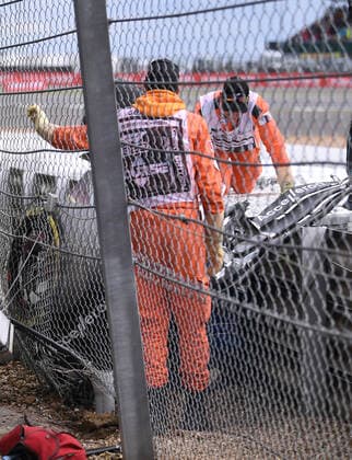 3rd July 2022, Silverstone Circuit, Silverstone, Northamptonshire, England: British F1 Grand Prix, Race day: Marshalls try and extract Zhou Guanyu from his car  ActionPlus12404632 SimonxWest
