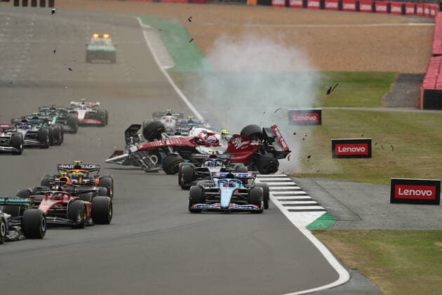 3rd July 2022, Silverstone Circuit, Silverstone, Northamptonshire, England: British F1 Grand Prix, Race day: Race start, Alfa Romeo F1 Team Orlen, Guanyu Zhou crashes after locking wheels with George Russell  ActionPlus12404677 Octane