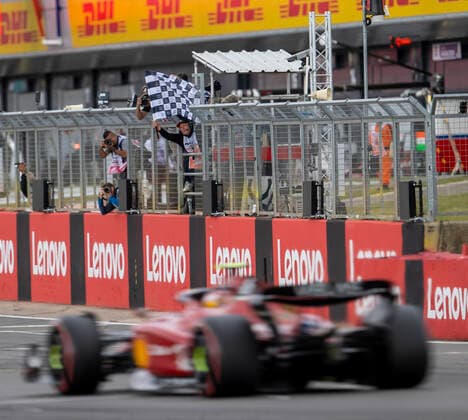 3rd July 2022, Silverstone Circuit, Silverstone, Northamptonshire, England: British F1 Grand Prix, Race day: Scuderia Ferrari driver Carlos Sainz Jr takes the chequered flag  ActionPlus12404774 TimxWilliams