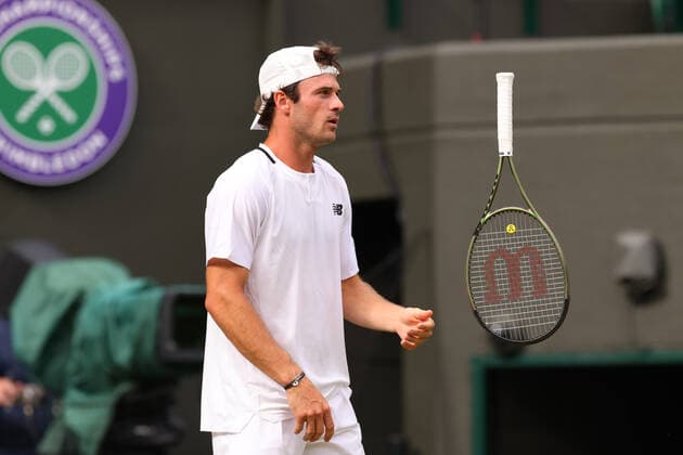3rd July 2022, All England Lawn Tennis and Croquet Club, London, England; Wimbledon Tennis tournament; Tommy Paul juggles with his racket during his match with Cameron Norrie in the mens singles  ActionPlus12404802 ShaunxBrooks