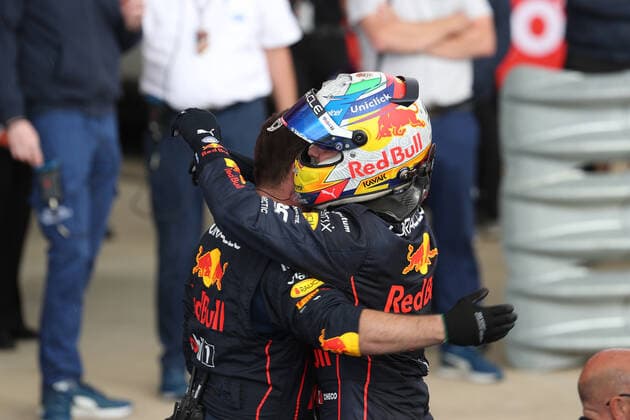 3rd July 2022, Silverstone Circuit, Silverstone, Northamptonshire, England: British F1 Grand Prix, Race day: Oracle Red Bull Racing, Sergio Perez comes second and is hugged by a team member  ActionPlus12404821 Octane