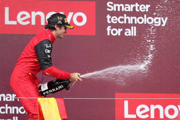 3rd July 2022, Silverstone Circuit, Silverstone, Northamptonshire, England: British F1 Grand Prix, Race day: Scuderia Ferrari, Carlos Sainz wins the British GP and celebrates on the podium  ActionPlus12404839 Octane