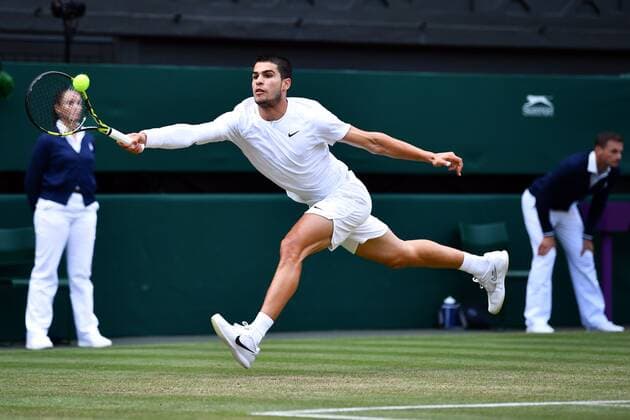 Mandatory Credit: Photo by James Veysey Shutterstock (13012856fw) Carlos Alcaraz during his fourth round match Wimbledon Tennis Championships, Day 7, The All England Lawn Tennis and Croquet Club, London, UK - 03 Jul 2022 Wimbledon Tennis Championships, Day 7, The All England Lawn Tennis and Croquet Club, London, UK - 03 Jul 2022  Copyright: xJamesxVeysey Shutterstockx 13012856fw