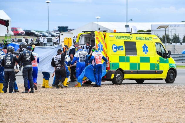 (220704) -- LONDON, July 4, 2022 -- Alfa Romeo s Chinese driver Zhou Guanyu receives medical treatment as he is stretchered off after a crash at the start of the Formula One British Grand Prix at the Silverstone motor racing, Motorsport circuit in Silverstone, Britain, on July 3, 2022. (Photo by Qian Jun Xinhua) (SP)BRITAIN-LONDON-F1 GRAND PRIX-CAR CRASH LixYing 