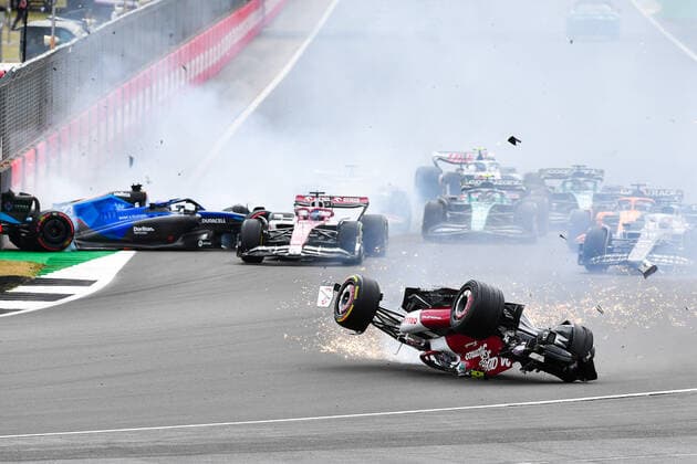 (220704) -- LONDON, July 4, 2022 -- Alfa Romeo s Chinese driver Zhou Guanyu crashes out at the start of the Formula One British Grand Prix at the Silverstone motor racing, Motorsport circuit in Silverstone, Britain, on July 3, 2022. (Photo by Qian Jun Xinhua) (SP)BRITAIN-LONDON-F1 GRAND PRIX-CAR CRASH LixYing 