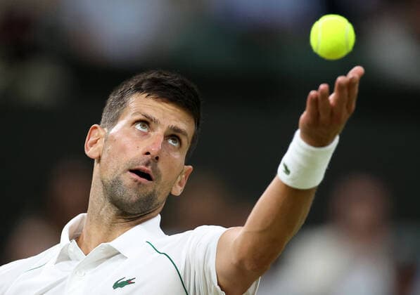 (220704) -- LONDON, July 4, 2022 -- Novak Djokovic of Serbia serves during the men s singles fourth round match against Tim Van Rijthoven of the Netherland at Wimbledon tennis Championship in London, Britain, on July 3, 2022. ) (SP)BRITAIN-LONDON-TENNIS-WIMBLEDON-MEN S SINGLES LixYing 