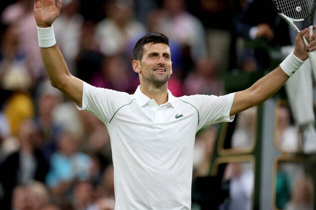 (220704) -- LONDON, July 4, 2022 -- Novak Djokovic of Serbia reacts after winning the men s singles fourth round match against Tim Van Rijthoven of the Netherland at Wimbledon tennis Championship in London, Britain, on July 3, 2022. ) (SP)BRITAIN-LONDON-TENNIS-WIMBLEDON-MEN S SINGLES LixYing 