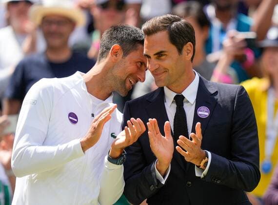 Mandatory Credit: Photo by Dave Shopland Shutterstock (13012855cg) Novak Djokovic and Roger Federer on Centre Court as part of the centenary celebrations Wimbledon Tennis Championships, Day 7, The All England Lawn Tennis and Croquet Club, London, UK - 03 Jul 2022 Wimbledon Tennis Championships, Day 7, The All England Lawn Tennis and Croquet Club, London, UK - 03 Jul 2022  Copyright: xDavexShopland Shutterstockx 13012855cg