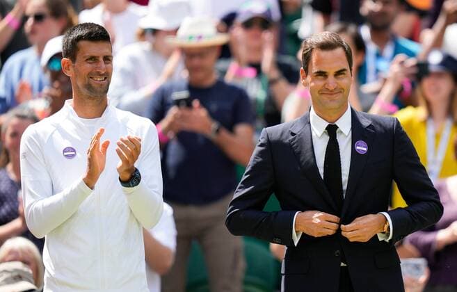 Mandatory Credit: Photo by Dave Shopland Shutterstock (13012855ci) Novak Djokovic and Roger Federer on Centre Court as part of the centenary celebrations Wimbledon Tennis Championships, Day 7, The All England Lawn Tennis and Croquet Club, London, UK - 03 Jul 2022 Wimbledon Tennis Championships, Day 7, The All England Lawn Tennis and Croquet Club, London, UK - 03 Jul 2022  Copyright: xDavexShopland Shutterstockx 13012855ci