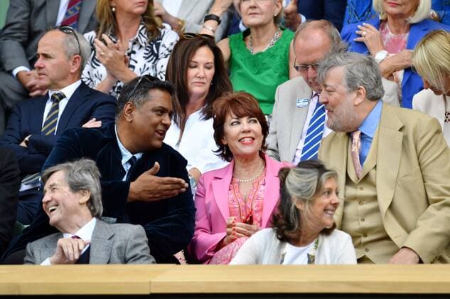 Mandatory Credit: Photo by James Veysey Shutterstock (13012861m) Krishnendu Majumdar, Kathy Lette and Stephen Fry in the Royal Box on Centre Court Wimbledon Tennis Championships, Day 8, The All England Lawn Tennis and Croquet Club, London, UK - 04 Jul 2022 Wimbledon Tennis Championships, Day 8, The All England Lawn Tennis and Croquet Club, London, UK - 04 Jul 2022  Copyright: xJamesxVeysey Shutterstockx 13012861m
