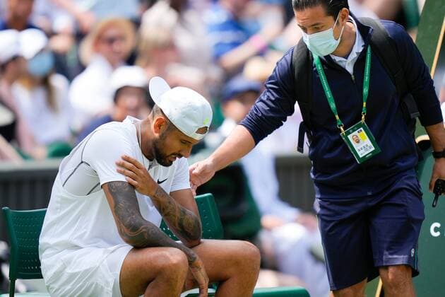 Mandatory Credit: Photo by Dave Shopland Shutterstock (13012860k) Nick Kyrgios is seen by the physic after he injures his arm during his fourth round match Wimbledon Tennis Championships, Day 8, The All England Lawn Tennis and Croquet Club, London, UK - 04 Jul 2022 Wimbledon Tennis Championships, Day 8, The All England Lawn Tennis and Croquet Club, London, UK - 04 Jul 2022  Copyright: xDavexShopland Shutterstockx 13012860k
