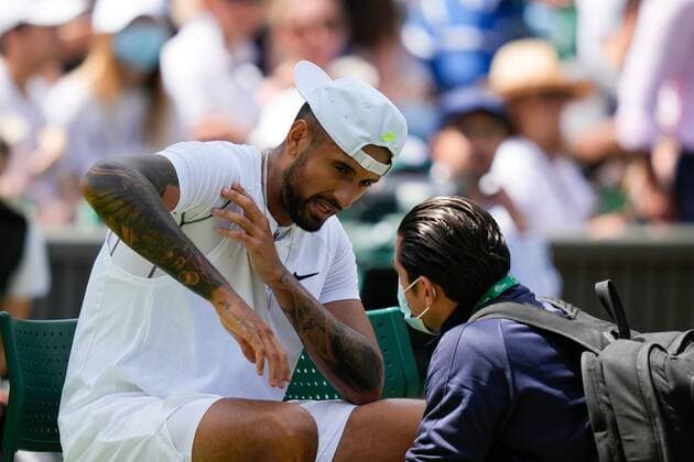 Mandatory Credit: Photo by Dave Shopland Shutterstock (13012860n) Nick Kyrgios is seen by the physic after he injures his arm during his fourth round match Wimbledon Tennis Championships, Day 8, The All England Lawn Tennis and Croquet Club, London, UK - 04 Jul 2022 Wimbledon Tennis Championships, Day 8, The All England Lawn Tennis and Croquet Club, London, UK - 04 Jul 2022  Copyright: xDavexShopland Shutterstockx 13012860n