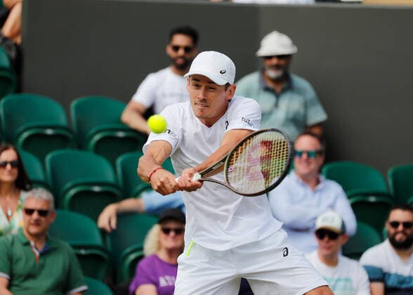 4th July 2022, All England Lawn Tennis and Croquet Club, London, England; Wimbledon Tennis tournament; Alexde Minaur (AUS) plays a backhand to Cristian Garin (CHL)  ActionPlus12405055 JohnxPatrickxFletcher