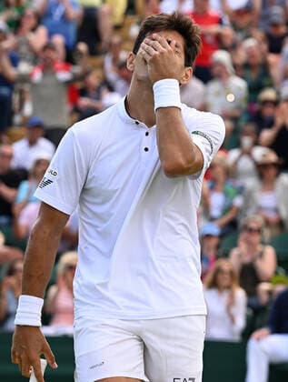 Sport Bilder des Tages Tennis Championships - Week One - Day Eight - All England Lawn Tennis Club, Wimbledon - Monday 4th July 2022 Cristian Garin (CHI) v Alex de Minaur (AUS) Cristian Garin celebrates winning match point 
