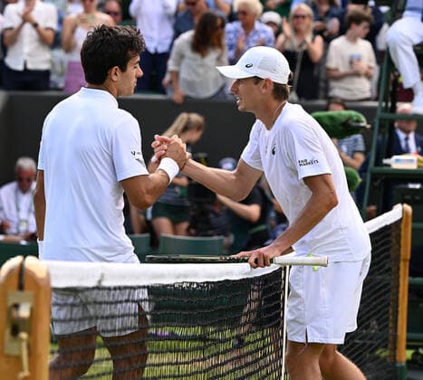 Tennis Championships - Week One - Day Eight - All England Lawn Tennis Club, Wimbledon - Monday 4th July 2022 Cristian Garin (CHI) v Alex de Minaur (AUS) Alex de Minaur congratulates Cristian Garin on winning match point 