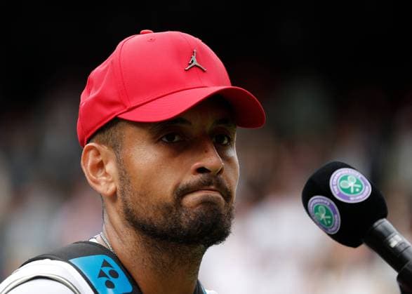4th July 2022, All England Lawn Tennis and Croquet Club, London, England; Wimbledon Tennis tournament; Nick Kyrgios (AUS) interviewed after defeating Brandon Nakashima (USA) at Centre Court while wearing a Jordan baseball cap  ActionPlus12405133 JohnxPatrickxFletcher