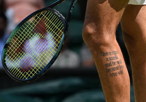 Tennis Championships - Week One - Day Eight - All England Lawn Tennis Club, Wimbledon - Monday 4th July 2022 Brandon Nakashima (USA) v Nick Kyrgios (AUS) Nick Kyrgios Tattoo on his leg is a quote of Oscar Wilde. ˜Give a man a mask and he will become is true self™ 