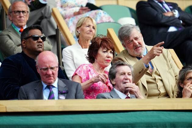 Mandatory Credit: Photo by Javier Garcia Shutterstock (13012862dg) Krishnendu Majumdar, Kathy Lette and Stephen Fry in the Royal Box on Centre Court Wimbledon Tennis Championships, Day 8, The All England Lawn Tennis and Croquet Club, London, UK - 04 Jul 2022 Wimbledon Tennis Championships, Day 8, The All England Lawn Tennis and Croquet Club, London, UK - 04 Jul 2022  Copyright: xJavierxGarcia Shutterstockx 13012862dg
