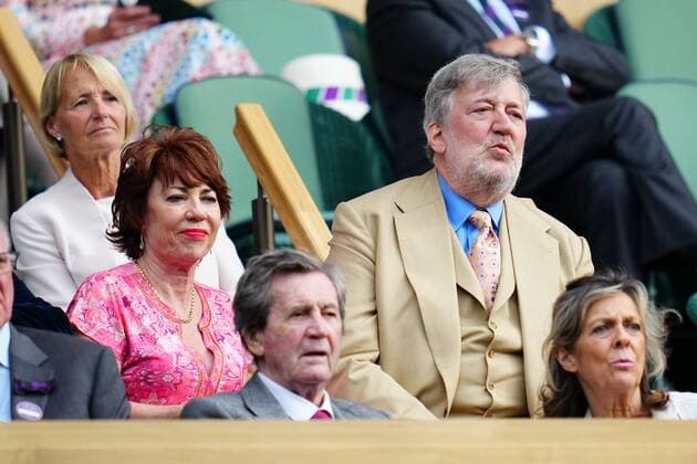 Mandatory Credit: Photo by Javier Garcia Shutterstock (13012862dh) Kathy Lette and Stephen Fry in the Royal Box on Centre Court Wimbledon Tennis Championships, Day 8, The All England Lawn Tennis and Croquet Club, London, UK - 04 Jul 2022 Wimbledon Tennis Championships, Day 8, The All England Lawn Tennis and Croquet Club, London, UK - 04 Jul 2022  Copyright: xJavierxGarcia Shutterstockx 13012862dh