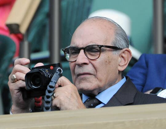 Tennis Championships - Week One - Day Eight - All England Lawn Tennis Club, Wimbledon - Monday 4th July 2022 Paula Badosa v Simona Halep Sir David Suchet takes photos on his camera on the match from the Royal Box 