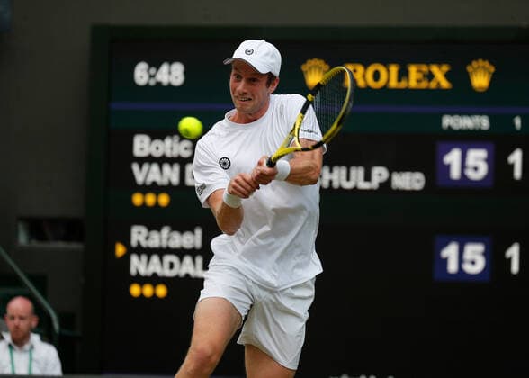 4th July 2022, All England Lawn Tennis and Croquet Club, London, England; Wimbledon Tennis tournament; Botic Van De Zandschulp (NED) plays a backhand to Rafael Nadal (ESP)  ActionPlus12405193 JohnxPatrickxFletcher