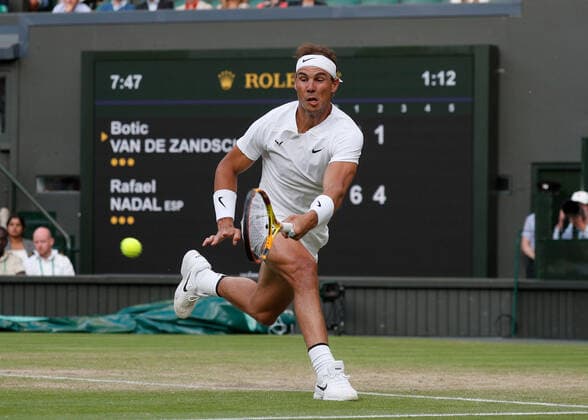 4th July 2022, All England Lawn Tennis and Croquet Club, London, England; Wimbledon Tennis tournament; Rafael Nadal (ESP) plays a forehand to Botic Van De Zandschulp (NED)  ActionPlus12405203 JohnxPatrickxFletcher