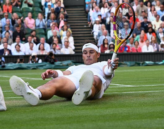 Tennis Championships - Week One - Day Eight - All England Lawn Tennis Club, Wimbledon - Monday 4th July 2022 Rafael Nadal v Botic van de Zandschulp Rafa Nadal of Spain slips over on the grass on Centre Court 