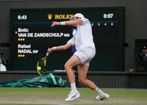 4th July 2022, All England Lawn Tennis and Croquet Club, London, England; Wimbledon Tennis tournament; Botic Van De Zandschulp (NED) plays a forehand to Rafael Nadal (ESP)  ActionPlus12405211 JohnxPatrickxFletcher