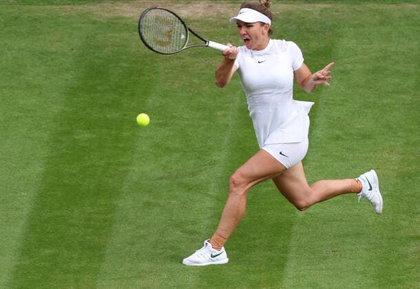 (220705) -- LONDON, July 5, 2022 -- Simona Halep of Romania hits a return during the women s singles fourth round match against Paula Badosa of Spain at Wimbledon Tennis Championship in London, Britain, on July 4, 2022. ) (SP)BRITAIN-LONDON-TENNIS-WIMBLEDON-WOMEN S SINGLES HanxYan 