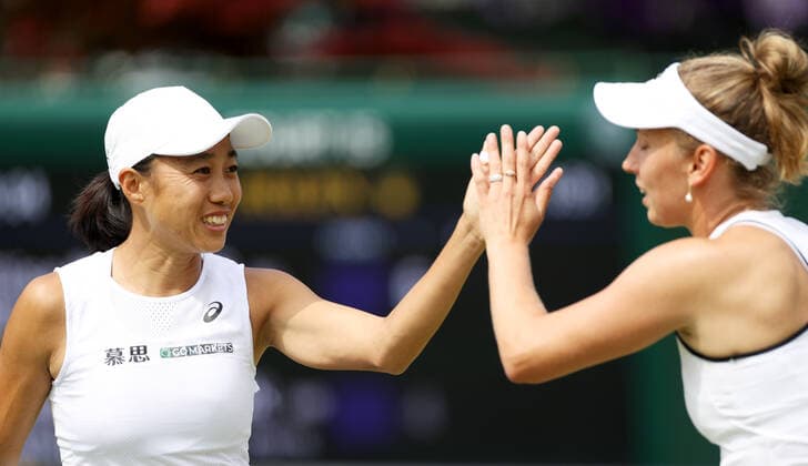 (220705) -- LONDON, July 5, 2022 -- Zhang Shuai (L) of China Elise Mertens of Belgium celebrate during the women s doubles third round match between Zhang Shuai of China Elise Mertens of Belgium and Nadiia Kichenok of Ukraine Raluca Olaru of Romania at Wimbledon Tennis Championship in London, Britain, on July 4, 2022. ) (SP)BRITAIN-LONDON-TENNIS-WIMBLEDON-WOMEN S DOUBLES LixYing 