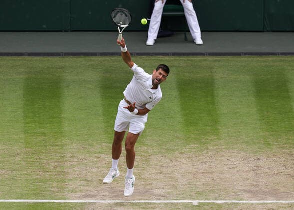 5th July 2022, All England Lawn Tennis and Croquet Club, London, England; Wimbledon Tennis tournament; Novak Djokovic (SRB) serves to Jannik Sinner (ITA) mens singles quarter-final  ActionPlus12405244 JohnxPatrickxFletcher