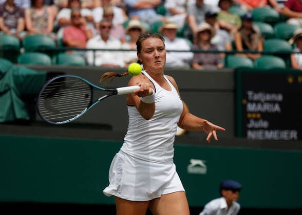5th July 2022, All England Lawn Tennis and Croquet Club, London, England; Wimbledon Tennis tournament; Jule Niemeier (GER) plays a forehand to Tatjana Maria (GER)  ActionPlus12405219 JohnxPatrickxFletcher