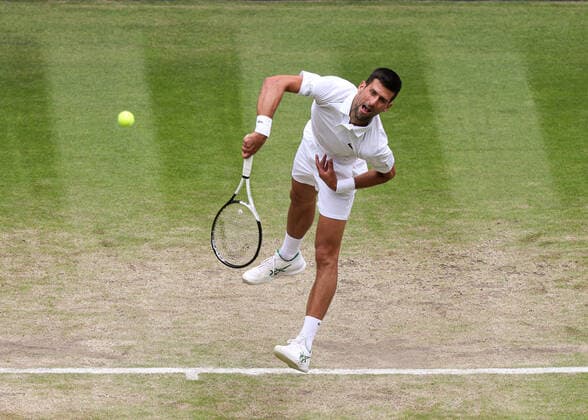 5th July 2022, All England Lawn Tennis and Croquet Club, London, England; Wimbledon Tennis tournament; Novak Djokovic (SRB) serves to Jannik Sinner (ITA) mens singles quarter-final  ActionPlus12405251 JohnxPatrickxFletcher