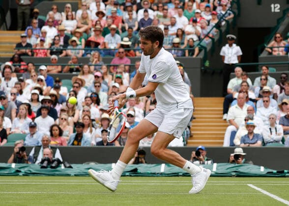 5th July 2022, All England Lawn Tennis and Croquet Club, London, England; Wimbledon Tennis tournament; Cameron Norrie (GBR) plays a forehand to David Goffin (BEL)  ActionPlus12405313 JohnxPatrickxFletcher