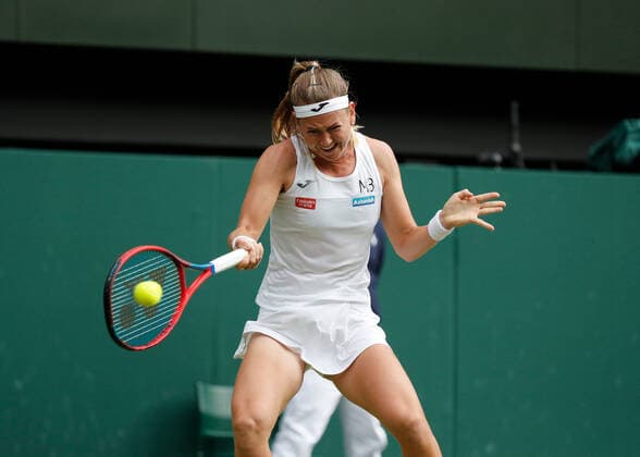 5th July 2022, All England Lawn Tennis and Croquet Club, London, England; Wimbledon Tennis tournament; Marie Bouzkova (CZE) plays a forehand to Ons Jabeur (TUN)  ActionPlus12405342 JohnxPatrickxFletcher