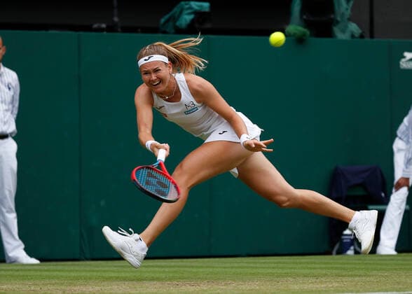 5th July 2022, All England Lawn Tennis and Croquet Club, London, England; Wimbledon Tennis tournament; Marie Bouzkova (CZE) plays a forehand to Ons Jabeur (TUN)  ActionPlus12405335 JohnxPatrickxFletcher