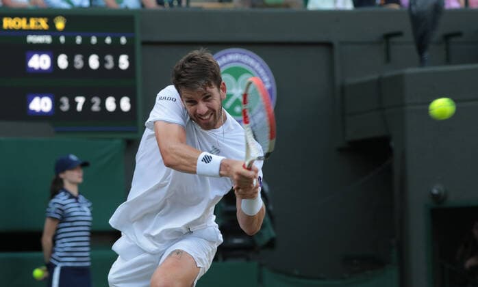 Cameron Norrie (GBR) returns a shot to David Goffin (BEL) during the Mens Singles Quarter-Final Match on No.1 Court on Day 9 of The Championships Wimbledon 2022 at All England Lawn Tennis and Croquet Club on July 5, 2022 in London, England.  Copyright: xx