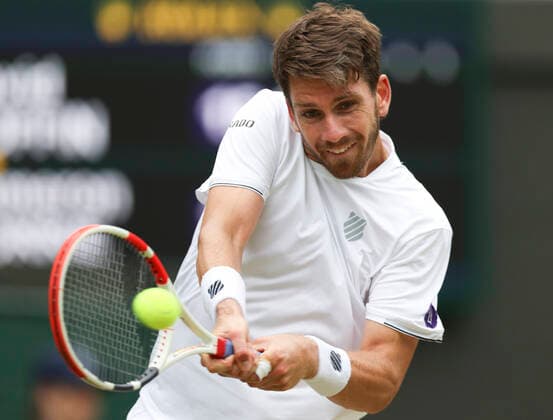 (220706) -- LONDON, July 6, 2022 -- Cameron Norrie of Britain hits a return during the men s singles quarter-final match against David Goffin of Belgium at Wimbledon Tennis Championship in London, Britain, on July 5, 2022. ) (SP)BRITAIN-LONDON-TENNIS-WIMBLEDON-MEN S SINGLES-QUARTERFINALS HanxYan 