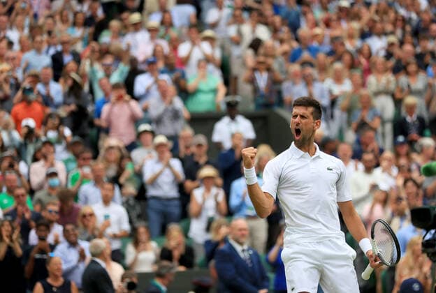 (220706) -- LONDON, July 6, 2022 -- Novak Djokovic of Serbia celebrates after winning the men s singles quarter-final match against Jannik Sinner of Italy at Wimbledon Tennis Championship in London, Britain, on July 5, 2022. ) (SP)BRITAIN-LONDON-TENNIS-WIMBLEDON-MEN S SINGLES-QUARTERFINALS LixYing 