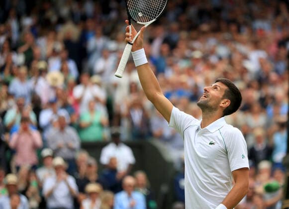 (220706) -- LONDON, July 6, 2022 -- Novak Djokovic of Serbia celebrates after winning the men s singles quarter-final match against Jannik Sinner of Italy at Wimbledon Tennis Championship in London, Britain, on July 5, 2022. ) (SP)BRITAIN-LONDON-TENNIS-WIMBLEDON-MEN S SINGLES-QUARTERFINALS LixYing 
