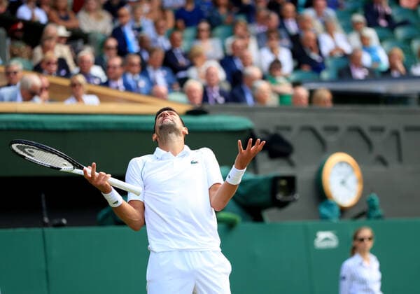 (220706) -- LONDON, July 6, 2022 -- Novak Djokovic of Serbia reacts during the men s singles quarter-final match against Jannik Sinner of Italy at Wimbledon Tennis Championship in London, Britain, on July 5, 2022. ) (SP)BRITAIN-LONDON-TENNIS-WIMBLEDON-MEN S SINGLES-QUARTERFINALS LixYing 
