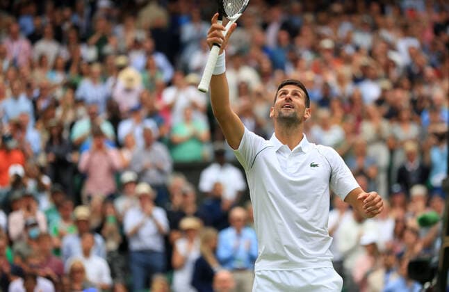 (220706) -- LONDON, July 6, 2022 -- Novak Djokovic of Serbia celebrates after winning the men s singles quarter-final match against Jannik Sinner of Italy at Wimbledon Tennis Championship in London, Britain, on July 5, 2022. ) (SP)BRITAIN-LONDON-TENNIS-WIMBLEDON-MEN S SINGLES-QUARTERFINALS LixYing 