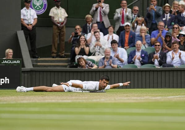 Tennis: Wimbledon championships Novak Djokovic of Serbia reacts after winning a point against Jannik Sinner of Italy in the quarterfinals of the Wimbledon tennis tournament in London on July 5, 2022.  A14AA0001310902P