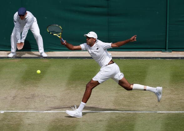6th July 2022, All England Lawn Tennis and Croquet Club, London, England; Wimbledon Tennis tournament; Rajeev Ram (USA) plays a forehand to Edouard Roger-Vasselin (FRA)  ActionPlus12405397 JohnxPatrickxFletcher